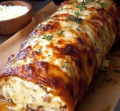 Käserolle mit 1 Rolle Blätterteig für 30 Minuten im Ofen gebacken